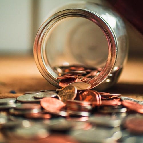 Change spilling out of a jar>