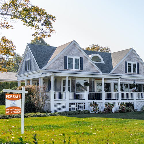 Home with For Sale Sign>