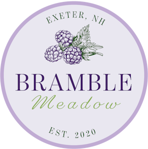 bramble meadow logo with purple circle and blackberries