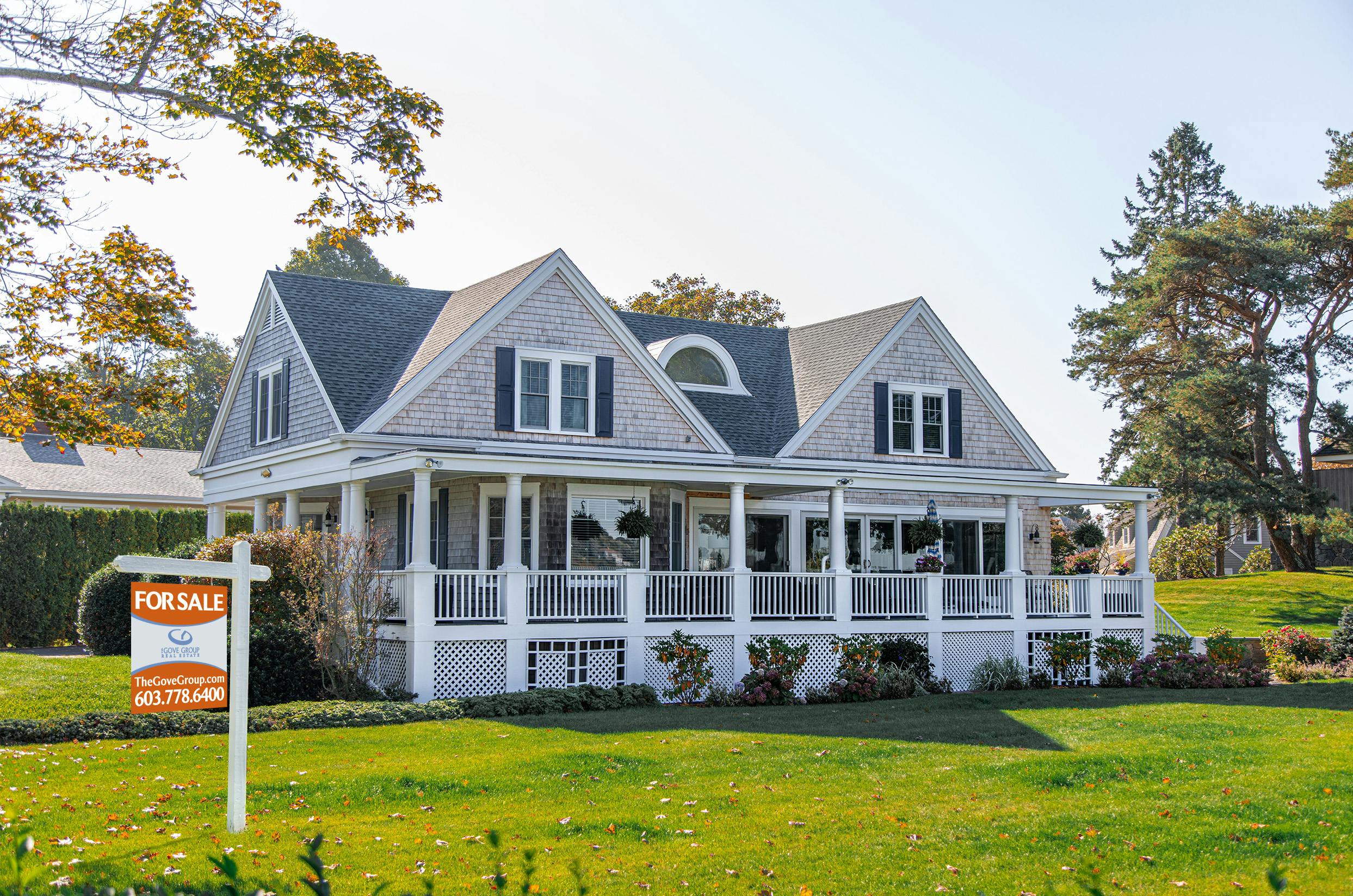 grey house with for sale sign