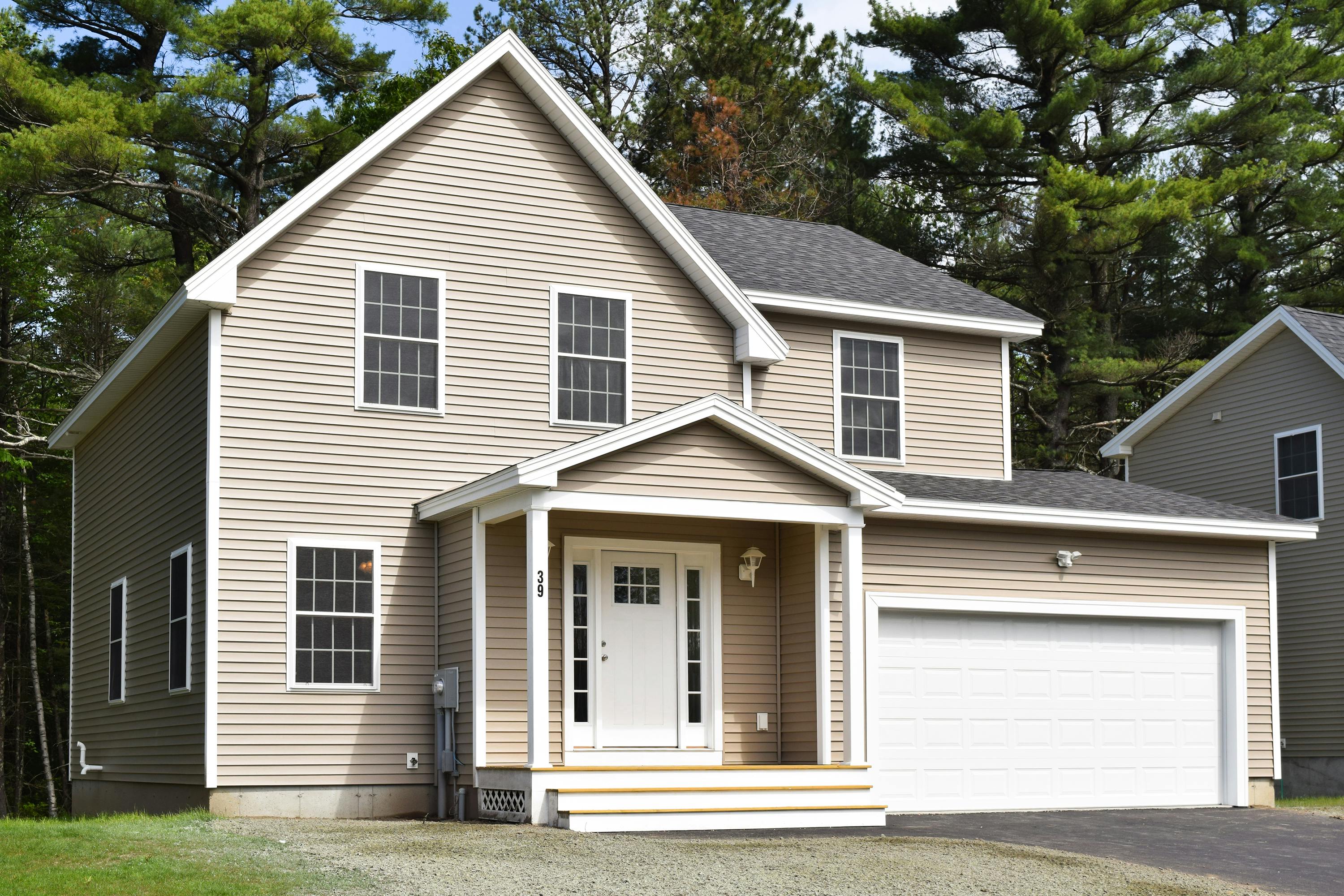 beige home with front porch