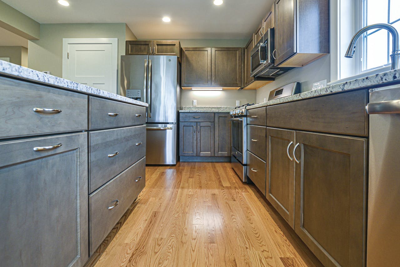 grey kitchen with granite counters in new home